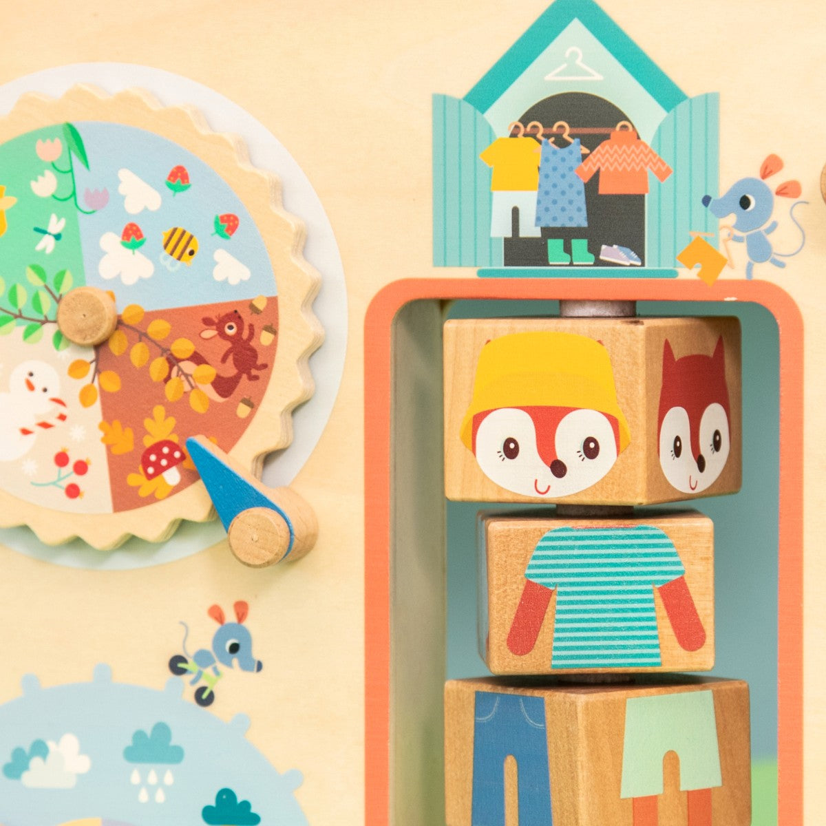 Lilliputiens aktivitetsbrett i tre, Klær for været