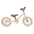 Trybike løbecykel, vintage creme retro look med brun saddel og håndtag.