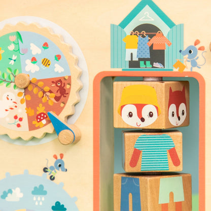 Lilliputiens aktivitetsbrett i tre, Klær for været