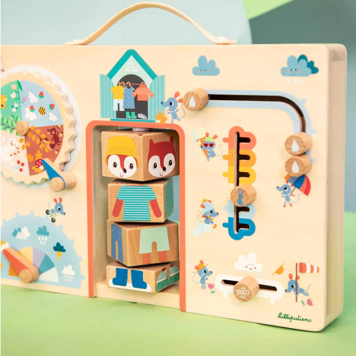 Lilliputiens aktivitetsbrett i tre, Klær for været