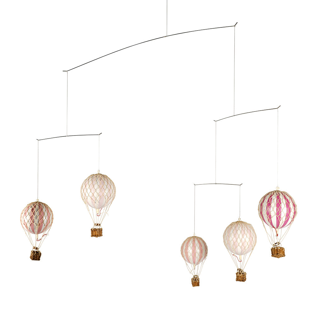 Uro med luftballoner i pink og beige farver